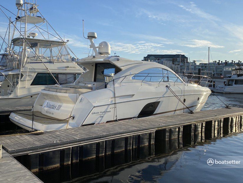 White and gold yacht scenery representing the 49% LLC equity partnership vessel