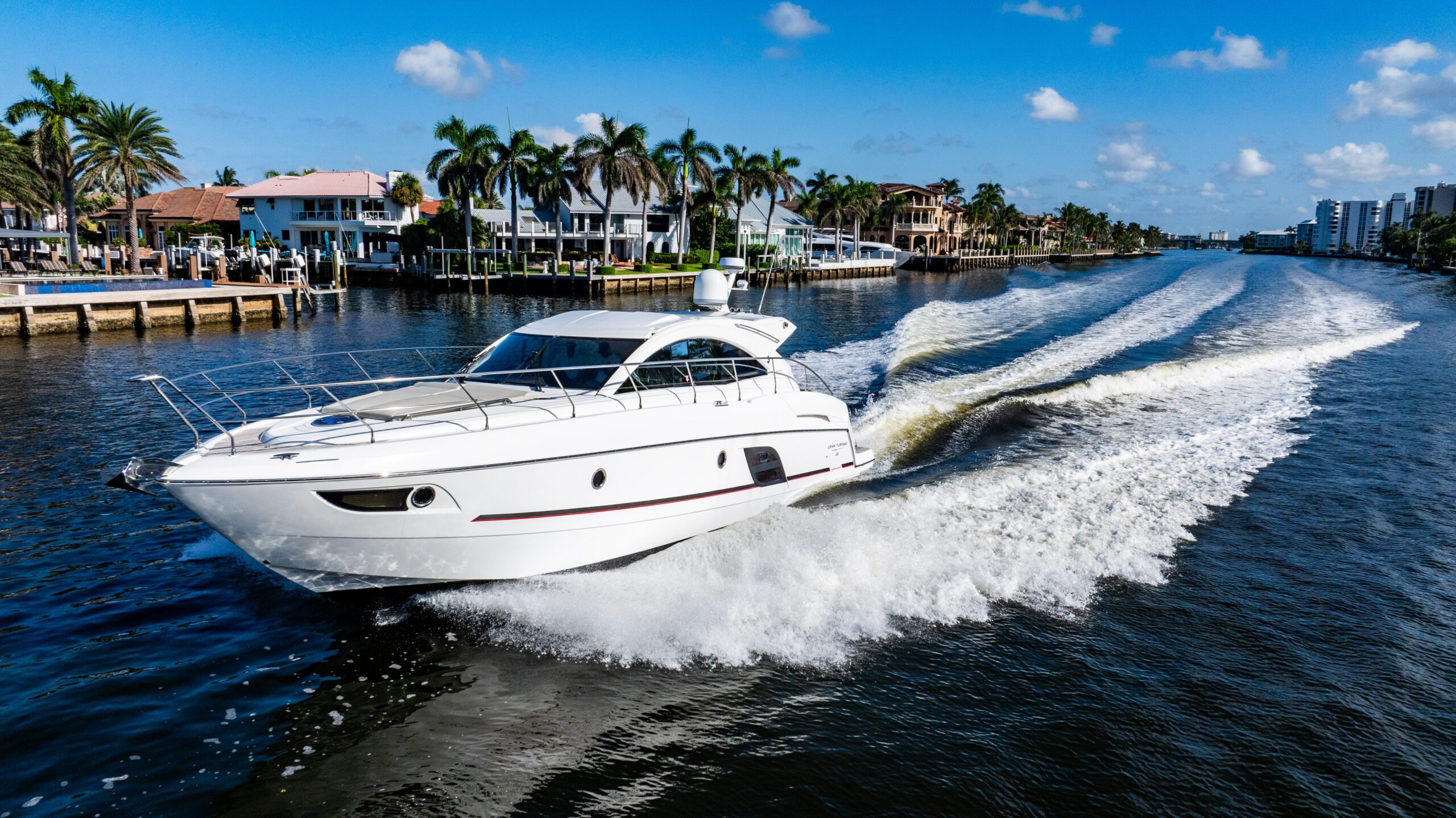 Bird's eye photography of a boat on the water used to illustrate the true cost of yacht ownership
